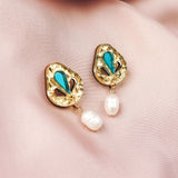 Handcrafted gold Basic Drop Earrings with turquoise teardrop accents and dangling white pearls, displayed on a soft, light pink satin fabric—perfect for adding subtle elegance to your minimalist fashion collection.
