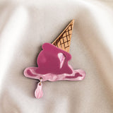 Add a touch of whimsy to your summer wardrobe with this handcrafted Melted Ice Cream Brooch, shaped like a pink melting scoop atop a waffle cone on creamy fabric, finished with a dangling pink drop.